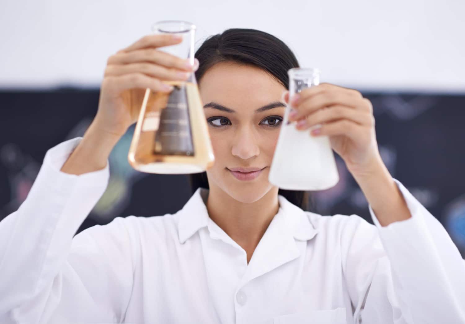 Woman laboratory and science beakers for medical experiment for investigation solution or futuristic Female person equipment and liquid for dna research or vaccine breakthrough cure or chemistry