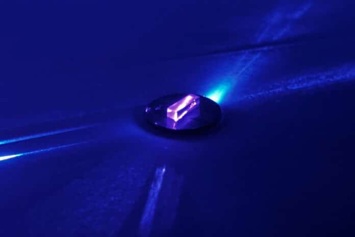 When trapped in a transparent, flourine-rich crystal, scientists can use a laser to excite the nucleus of a thorium-229 atom.