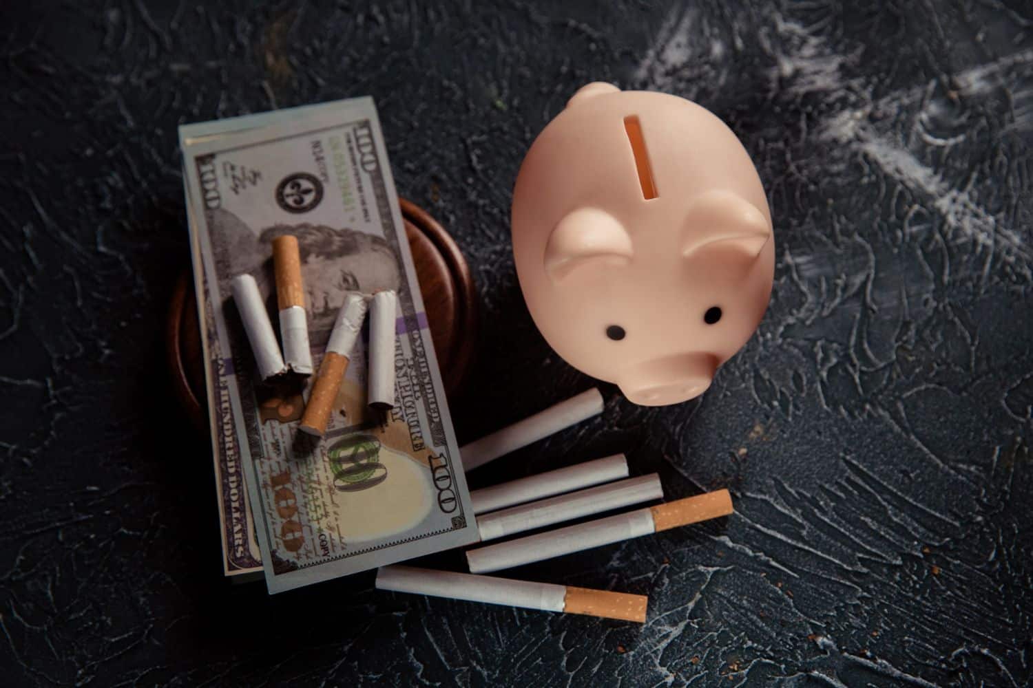 Piggy bank and cigarettes